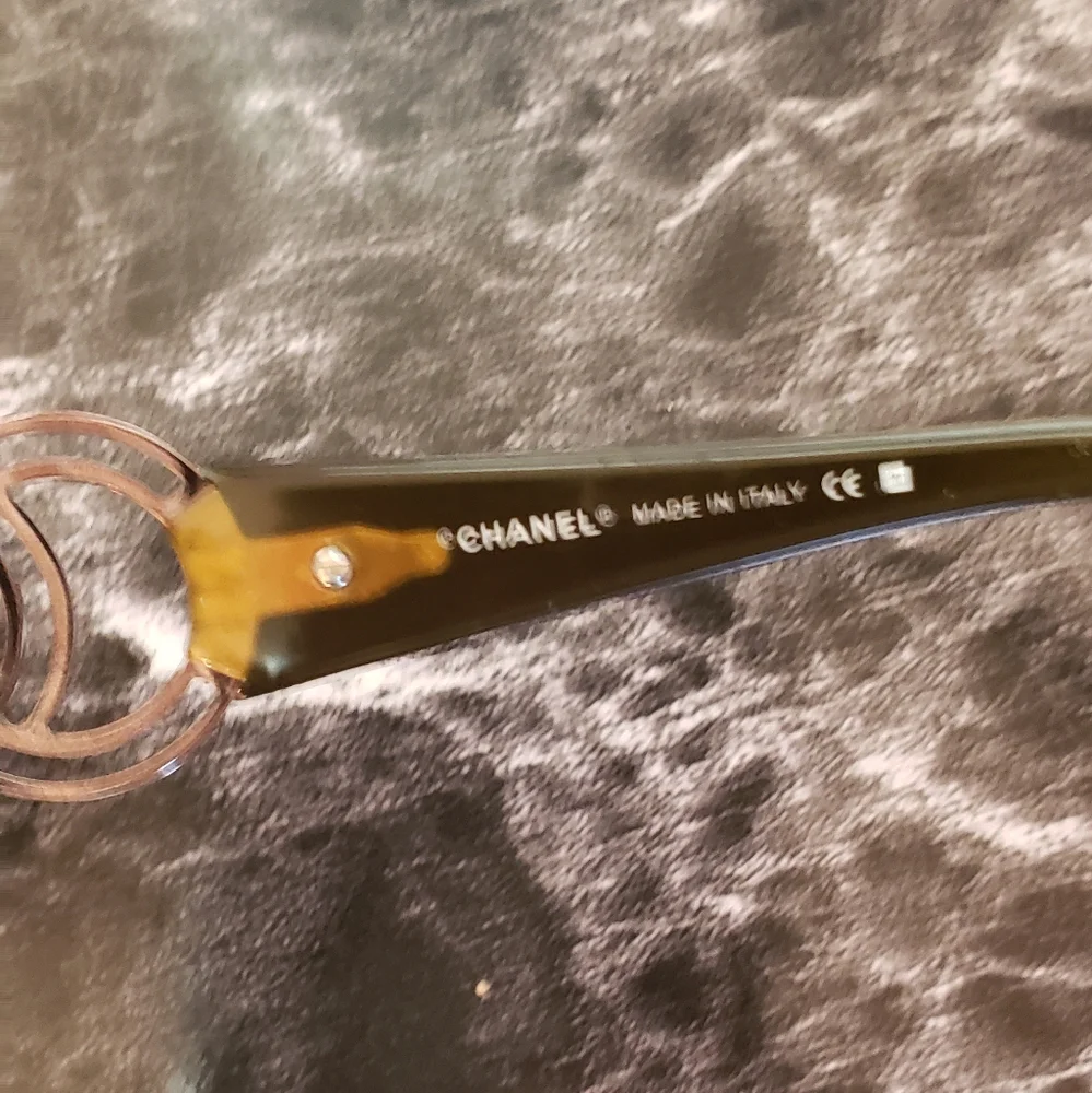 CHANEL Black Frames with Brown Gradient Lenses and Gold CC Accent Sunglasses.